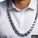 Home 21 실버 체인 목걸이 추천 - A sophisticated, close-up image of a classic robust silver chain necklace worn over a crisp white fo...